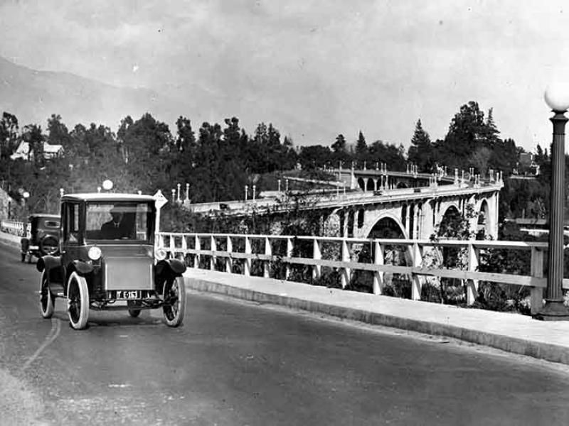 Black and white photo of vintage automobile on Colorado Street bridge