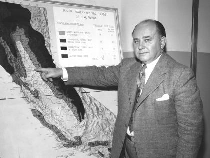  Frank Lanterman, CA State Assemblyman, in front of water map, c. 1950s